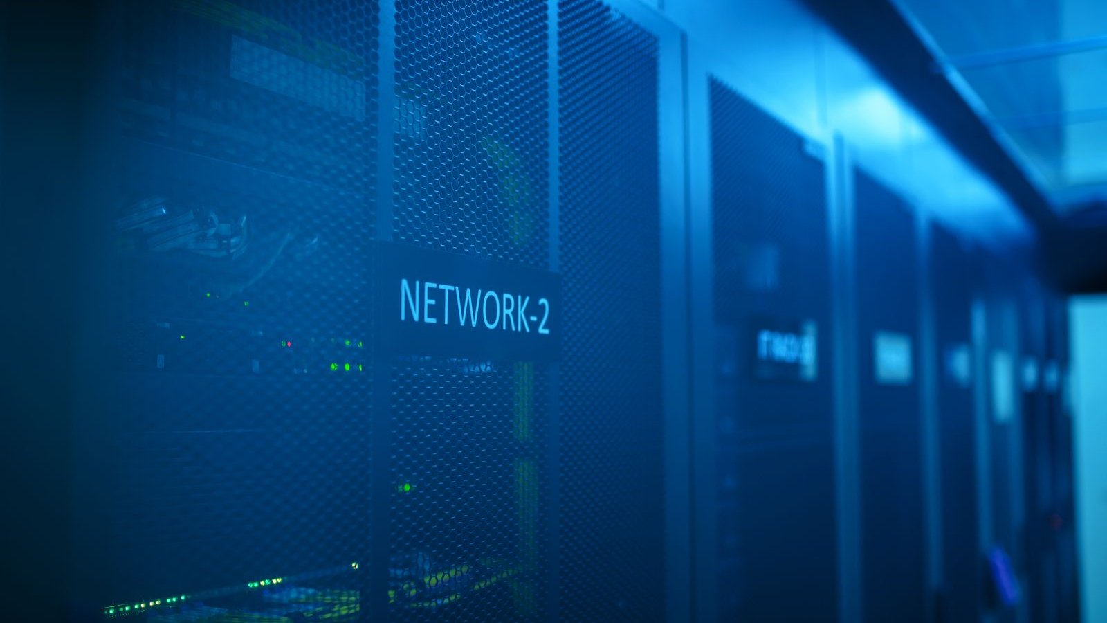 Blue-lit network rack in a data centre, representing the PHP web servers behind most WordPress websites in Malaysia